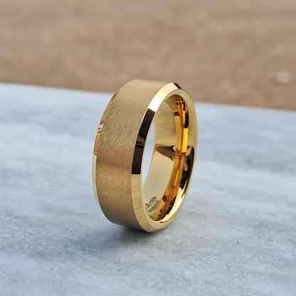This 8mm 24K Gold Plated Tungsten Ring, featuring a sleek brushed finish, offers a stylish and durable choice for men’s wedding bands.