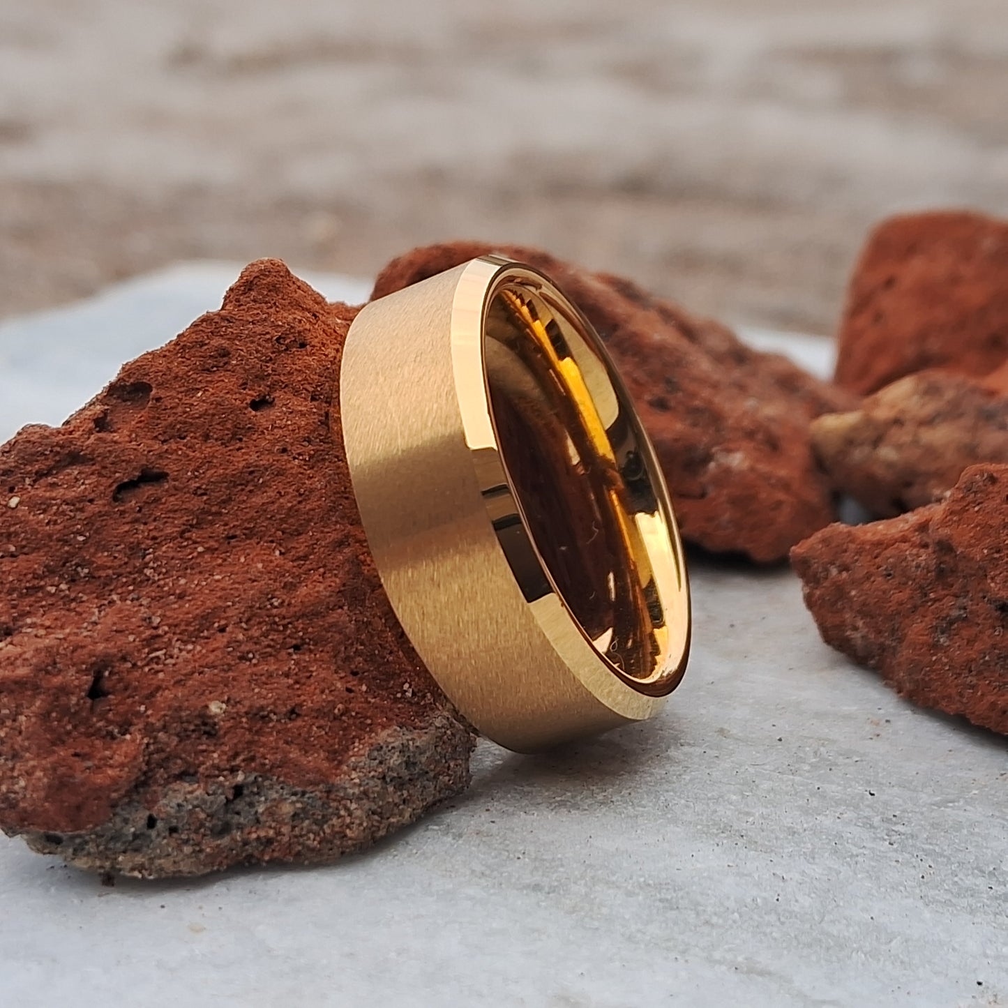 This 8mm 24K Gold Plated Tungsten Ring, featuring a sleek brushed finish, offers a stylish and durable choice for men’s wedding bands.