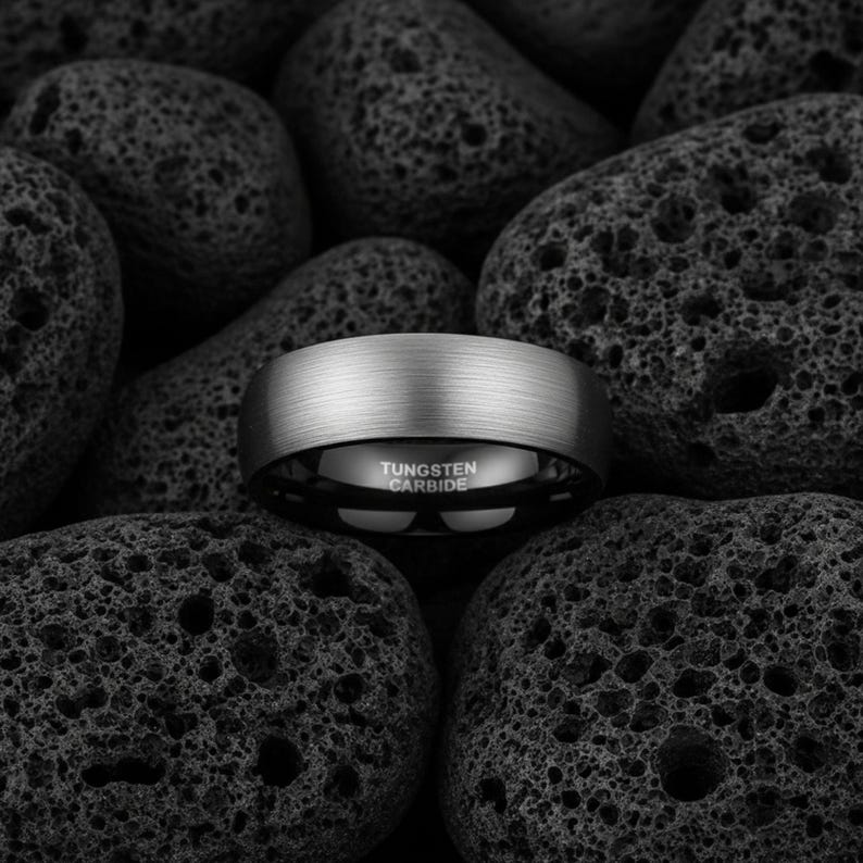 8mm brushed silver black tungsten carbide ring for men
Tungsten wedding band black interior comfort fit
Men's tungsten ring side view showing brushed finish
Custom engraved tungsten ring inner band
Man wearing black silver tungsten wedding band