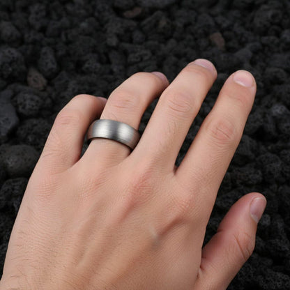 8mm brushed silver black tungsten carbide ring for men
Tungsten wedding band black interior comfort fit
Men's tungsten ring side view showing brushed finish
Custom engraved tungsten ring inner band
Man wearing black silver tungsten wedding band